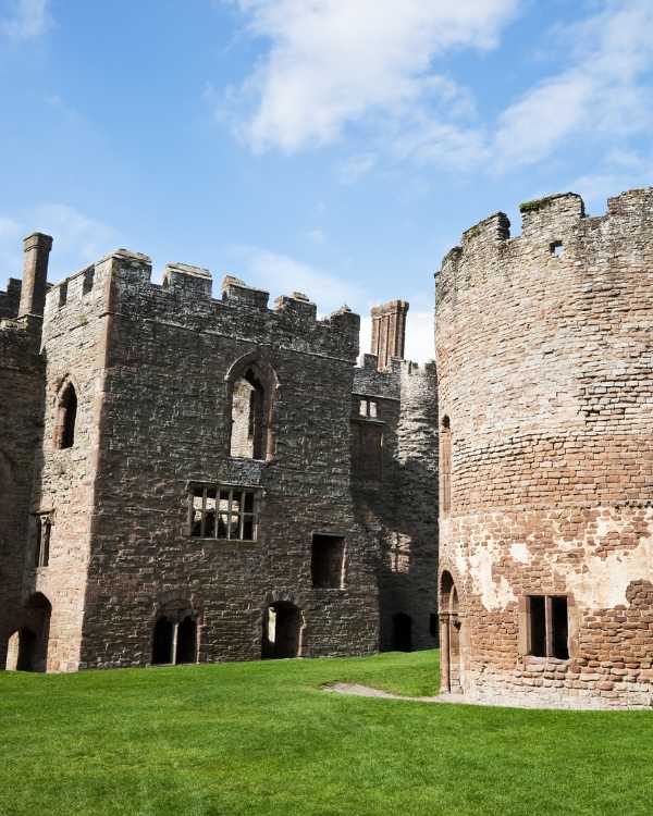 Image shows Ludlow Castle round tower and ramparts.