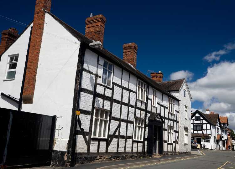 Image of some black and white timber frame buildings on the main street in Church Stretton to show what is nearby to The Holt holiday cottage